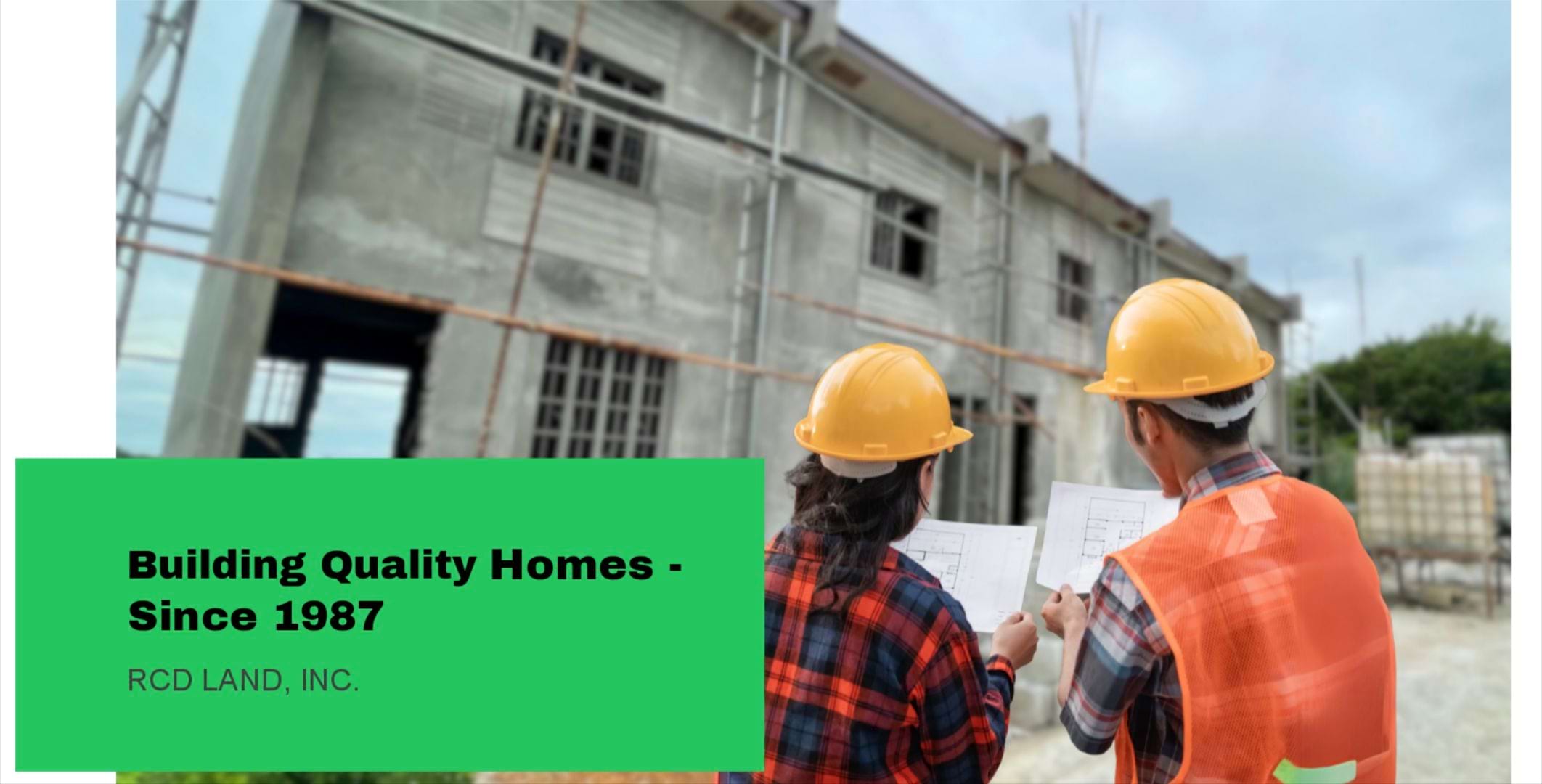 Two people, a man and a woman, looking at blueprints